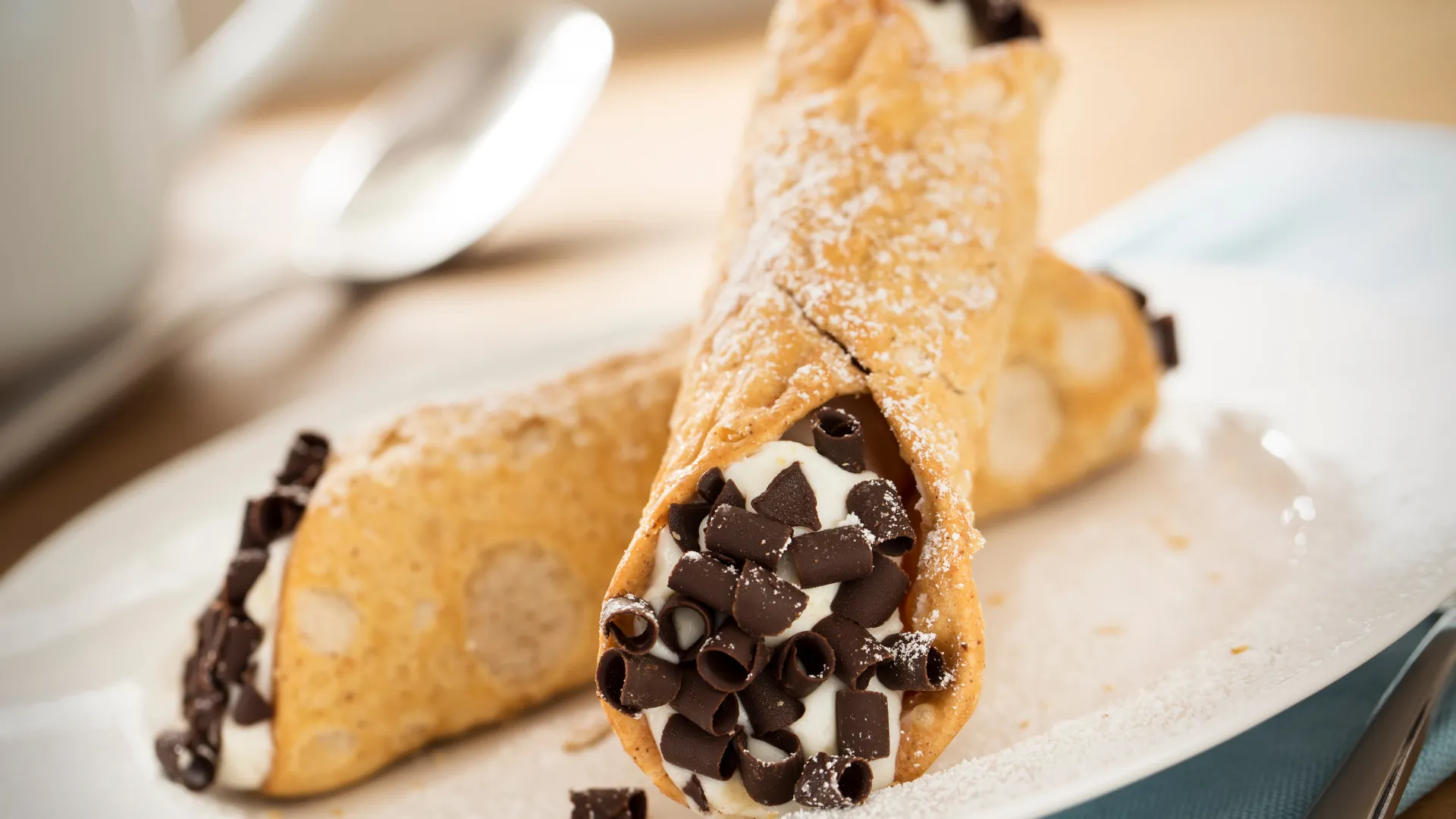 SICILIAN CANNOLI Home-made crispy cannoli shells filled with sweet ricotta cream and garshied with shaved dark chocolate and roasted pistachio. — Amalfi Italian Restaurant IOI City Mall Putrajaya
